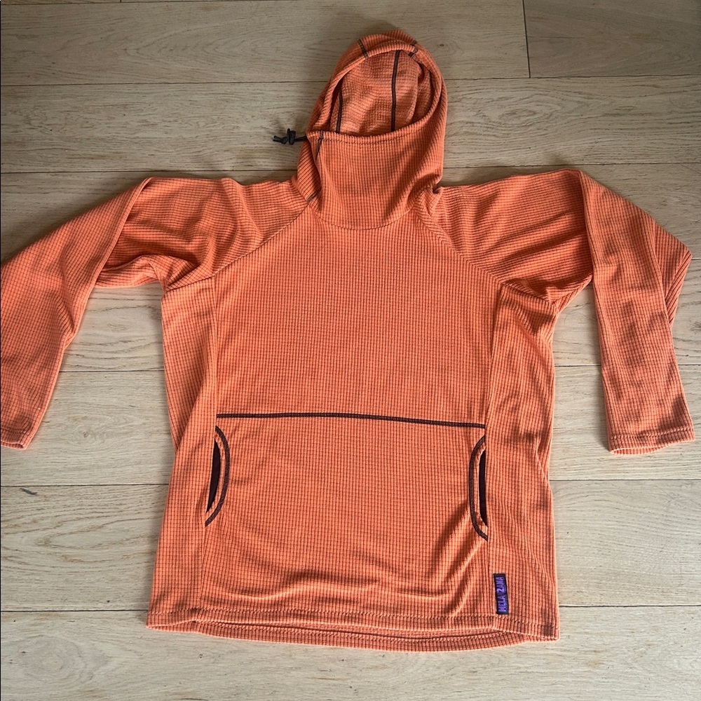 I am selling an orange men’s large melanzana